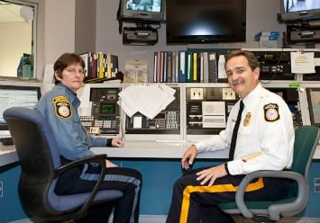 Dispatcher Sue DeWitt and Police Chief Doug Huber with Verona's current 911 system.