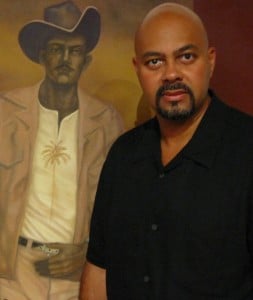 Raul Villarreal with one of his paintings.