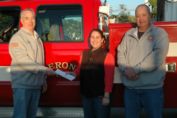 Verona Junior President, Kristen Donohue (center), presenting a check to the Verona Fire Department Chief Harvey Goodman (left), along with Ken Gerlach (right).