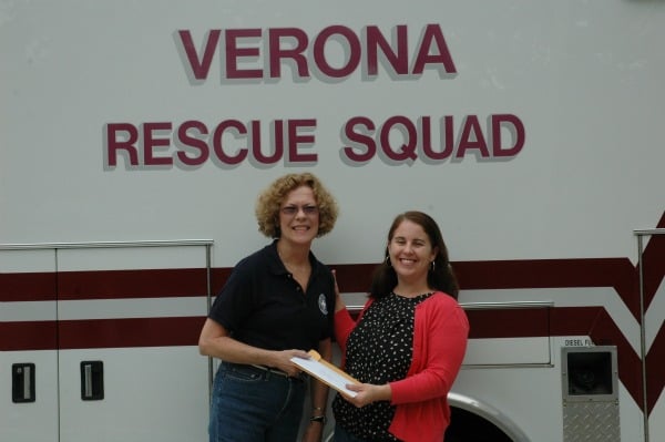 Sandy Bowman, the Vice President of the Verona Rescue Squad receiving a check from the Verona Juniors President, Kristen Donohue (right)