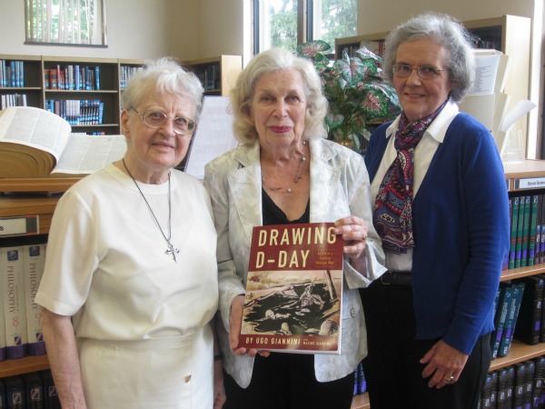 Sister Gerardine Mueller, O.P, professor emeriti at Caldwell College, and Nancy J. Becker, Ed.D., executive director of the college’s Jennings Library, flank Maxine Giannini of West Orange, N.J., who donated two drawings by her husband and a book of his writings on his World War II experiences to the college.
