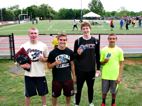 Sweeney (second from right) with the 4 x 400 team and its silver medals 