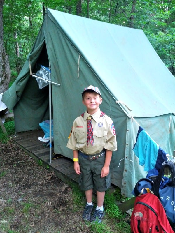 George Donnelly, ready for dinner in his Class A uniform, proudly poses in front of his tent.