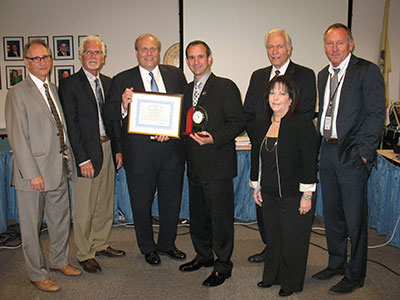 Mark Mautone, center, with (l-r) Roger Bowley, principal of Wallace Elementary School; Tom Fitzgibbons, retired director of Special Services, Hoboken School District; David C. Hespe, acting commissioner of Education; Richard Brockel, interim superintendent, Hoboken; Monica Tone, interim Hudson County executive superintendent, and Mark Biedron, president, New Jersey State Board of Education.