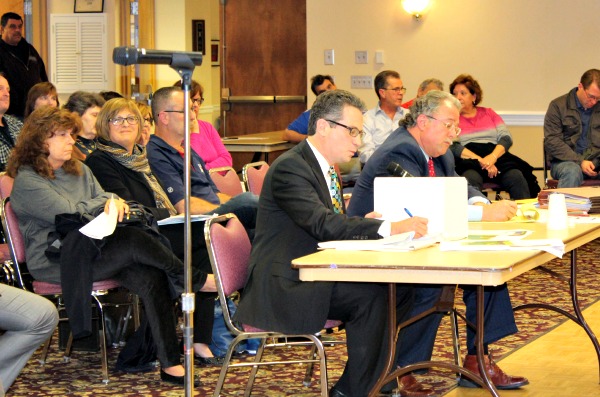 Robert F. Simon (table left), the lawyer for the Be A Good Neighbor group, at the hearing. Board of Education lawyer Douglas J. Kovats is at right.