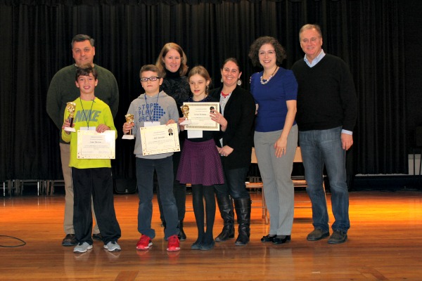Jeffrey Monacelli, principal of Forest Avenue Elementary School; Elizabeth Giblin, president of the Verona Library Board of Trustees; Kristen Donohue, education chair of the Junior Woman’s Club of Verona; Christine McGrath, president of the Junior Woman’s Club of Verona; and Bob Manley, mayor of Verona; front row, from left to right – Evan Bannon, Nick Handler and Zoriana Horodysky.