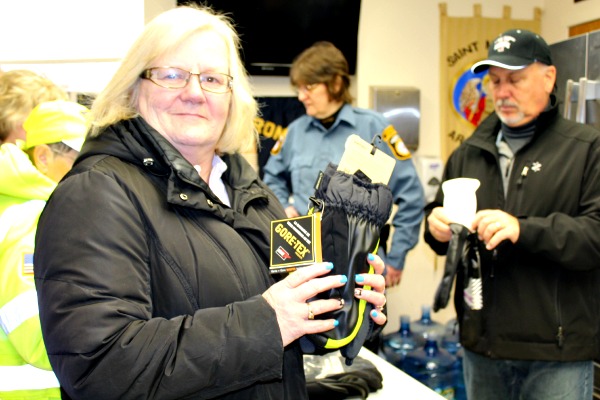 Crossing guard Judy McSeveney shows off her new gloves.