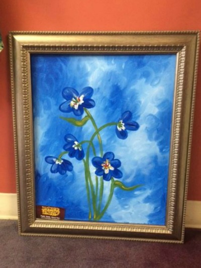 Forget-Me-Not painting donated by Pinot's Palette in Montclair.