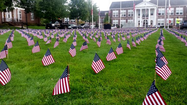 Volunteers again laid out 2,977 flags in the center of Verona, one for each person who died in the 9/11 terrorist attacks.