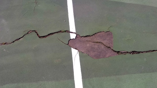 The current VHS tennis courts are riddled with cracks and dead ball zones.