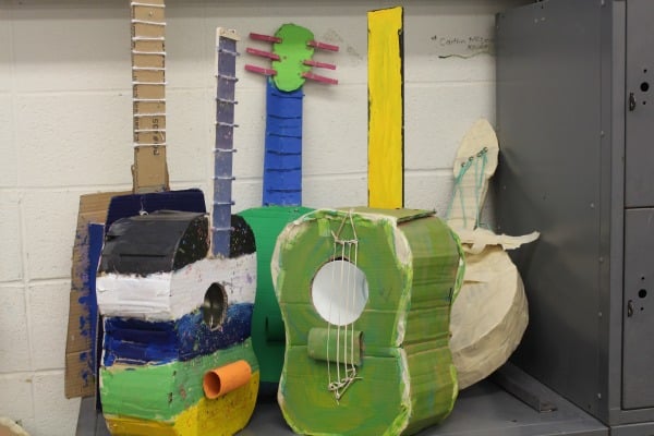 With a bit of programming, these cardboard guitars can play music.