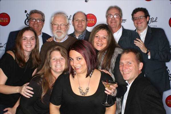 Paul Kneis (top row, second from right) and his team at the Little Kids Rock Annual Benefit that was hosted this past October. 