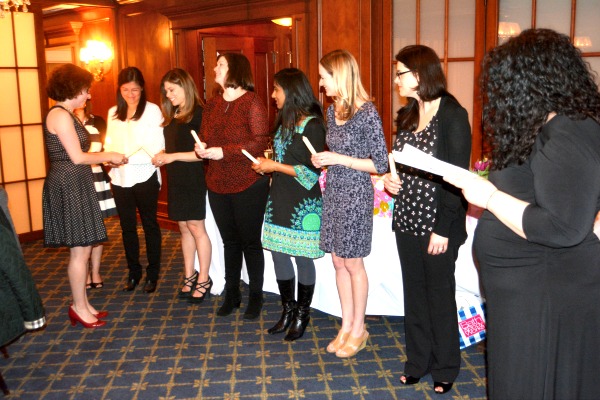 Outgoing Junior Woman's Club of Verona President Christine McGrath installs new members at the March 2016 installation dinner.