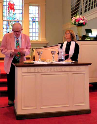 Clerk of Session, Dorman Craig, assists Pastor Lynn Rubier-Capron during communion.