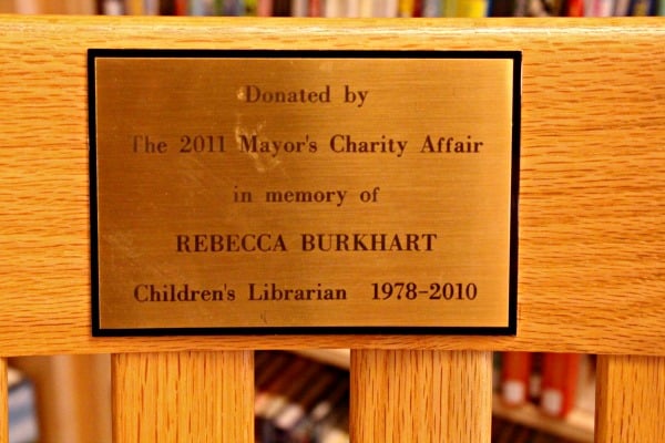 The plaque on the Children's Room's rocking chair.
