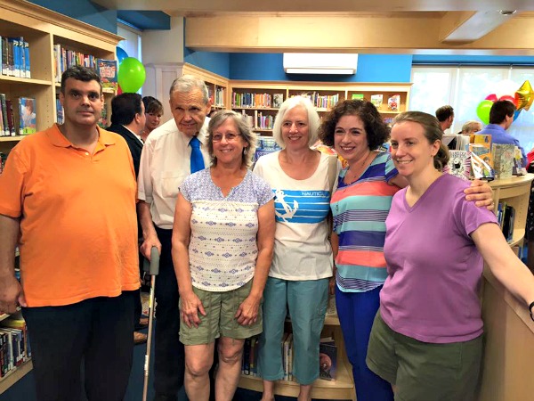 Robert Boeck, second from left, and other volunteers of the Friends of the Verona Public Library at the recent opening of the Verona Public Library Children’s Room in June. Mr. Boeck is being recognized by the Friends for over 30 years of service to the organization.  