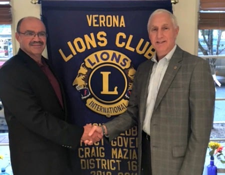 New Lions President Myron Spektor (left), with outgoing President Steve Janett.