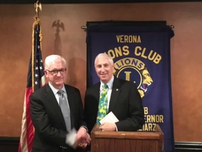 Steve Janett, past president of the Verona Lions, presents Richard Sinton, committee chairman of Verona Boy Scouts Troop 2, a check for $500.  This donation will help the troop provide additional training and purchase necessary equipment.  