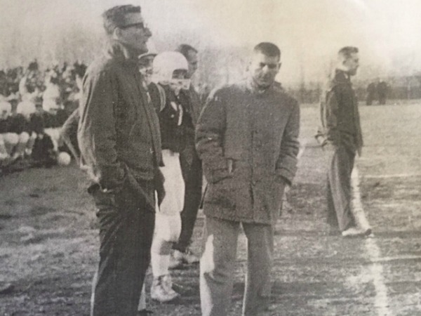 Tom Sellitto, second from right, on the sidelines of his favorite sport.