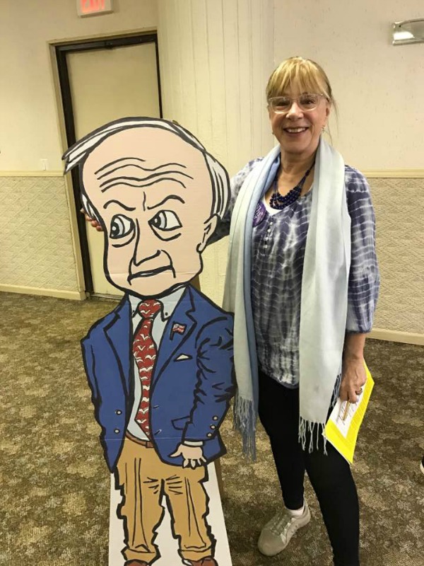 Verona resident Cinzia Cortese poses with the cutout at an NJ11th For Change town hall.