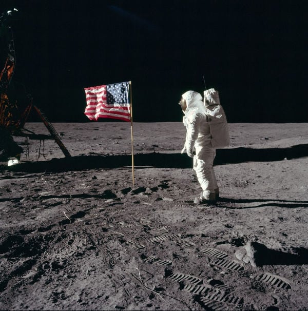 Buzz Aldrin with an American flag on the moon during the Apollo 11 landing.